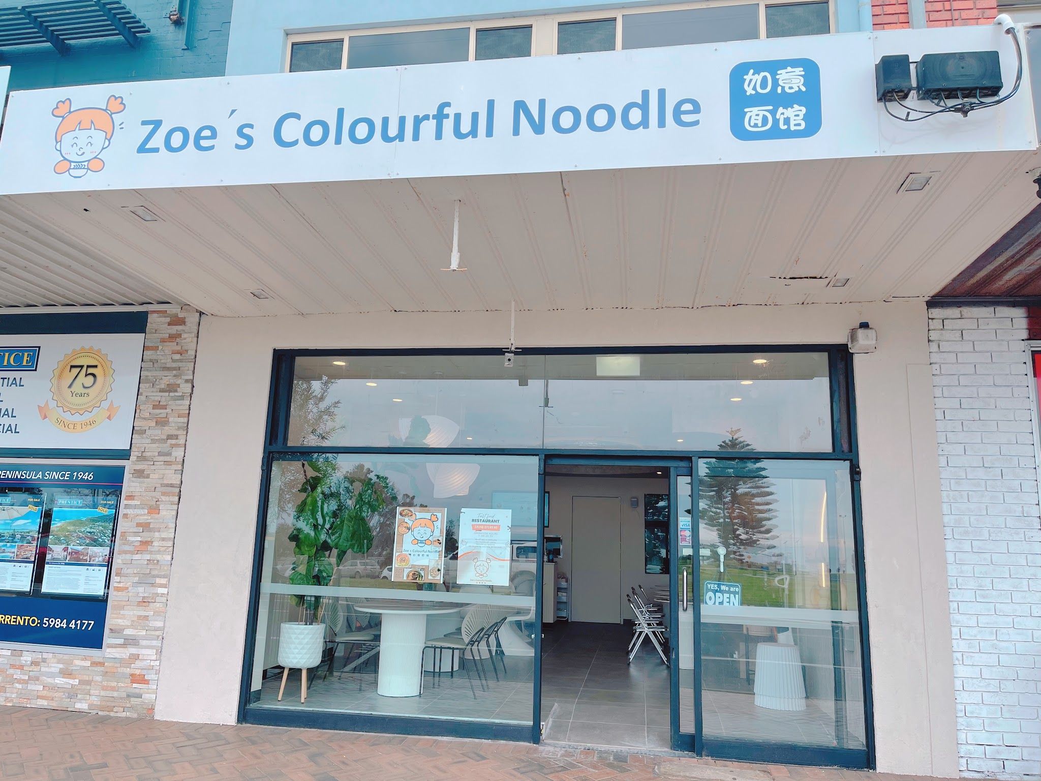 Zoe's Colourful Noodle shopfront with blue signage and large glass windows on Point Nepean Road